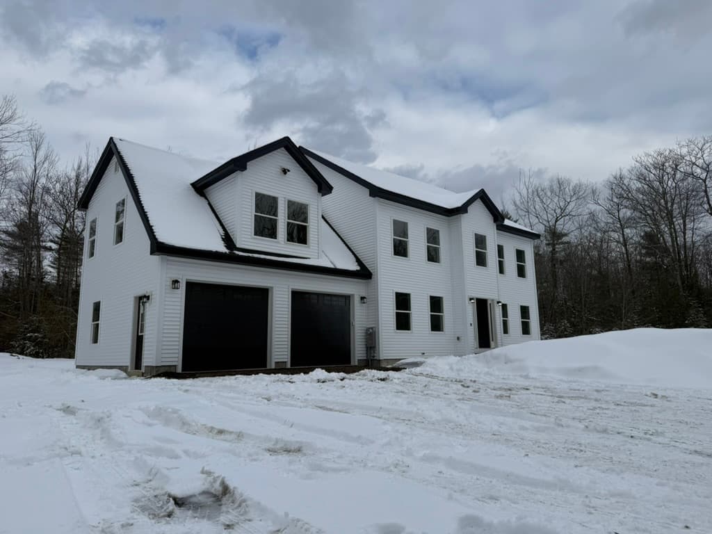 Finished white farmhouse with new roofing by Apex Exteriors